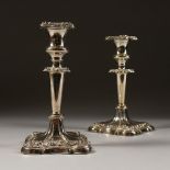 A PAIR OF CANDLESTICKS, with repousse scrolls etc. 8ins high. Birmingham 1903.