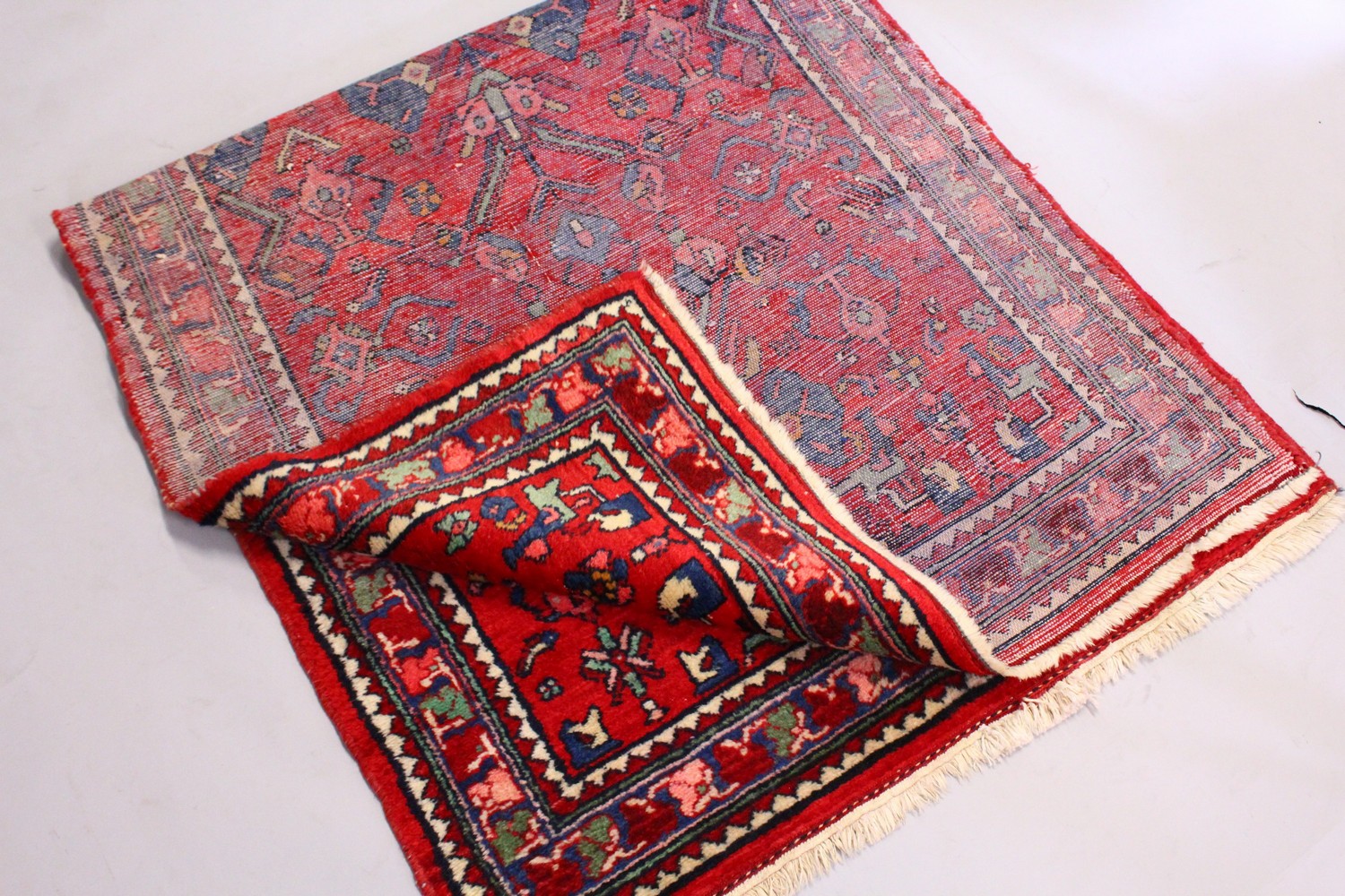 A PERSIAN RUG, with red and blue design. 6ft 8ins x 3ft 4ins. - Image 3 of 6