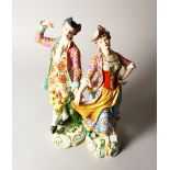 A GOOD PAIR OF SAMSON OF PARIS CHELSEA FIGURES OF A GALLANT AND LADY in 18th century attire. 12ins