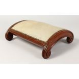 A SMALL MAHOGANY DOMED FOOTSTOOL with padded top. 13.5ins long.