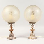 A PAIR OF METAL LAMPS with prism drops and frosted domes. 13ins high.