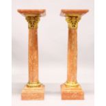 A GOOD PAIR OF MARBLE AND ORMOLU COLUMNS, with square tops, ornate collars, plain turned column