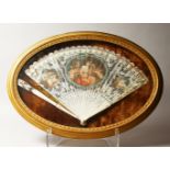 A GOOD 18TH CENTURY FRENCH IVORY FAN, painted with classical figures, 16ins wide open, in a gilt,