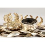 A SET OF FIVE LAUREL LEAF MENU HOLDERS, serviette ring and various spoons.