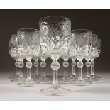 A MATCHING SET OF TWELVE MEDIUM WINE GLASSES, engraved with fruiting vines.