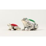 TWO CAST SILVER FROG PIN CUSHIONS.