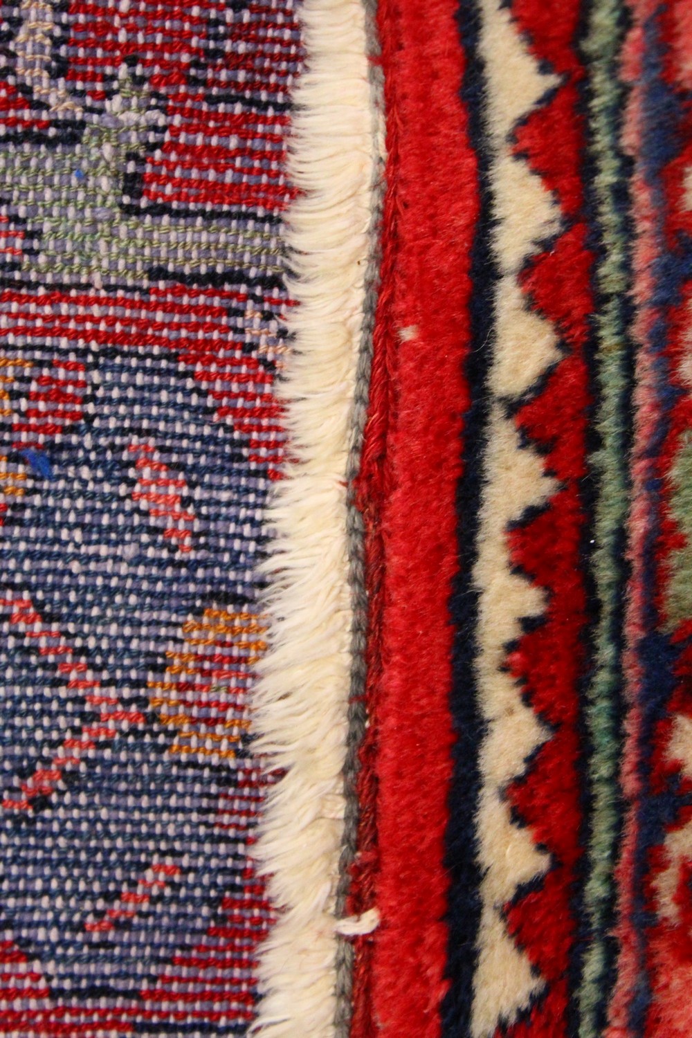 A PERSIAN RUG, with red and blue design. 6ft 8ins x 3ft 4ins. - Image 6 of 6