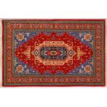 A VERY GOOD PERSIAN RUG, with central motif, with red and blue ground. 6ft 9ins x 4ft 2ins.