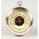 A CIRCULAR BAROMETER, 4.25ins diameter, in a hammered silver mounted wooden frame. Birmingham 1910.