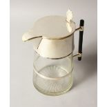 A CHRISTOPHER DRESSER DESIGN GLASS LEMONADE JUG with plated lid and ebony handle.