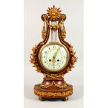 A GOOD FRENCH LYRE CLOCK, with ormolu mounts, eight-day movement, the dial painted with garlands.