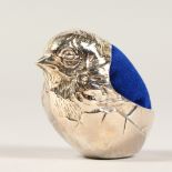 A SILVER CHUBBY BIRD PIN CUSHION.