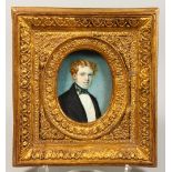 AN OVAL PORTRAIT OF A YOUNG MAN, head and shoulders, oval, in a gilt frame. 3ins x 2ins.