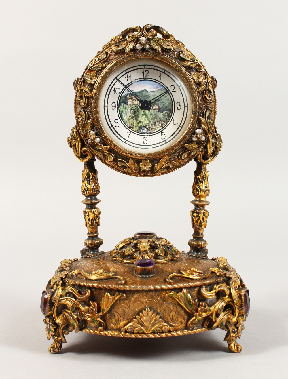 A VERY GOOD RUSSIAN SILVER GILT MUSICAL CLOCK, set with semi-precious stones, the face painted