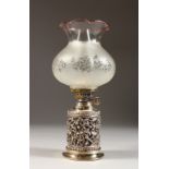 A VICTORIAN SILVER MOUNTED OIL LAMP, with funnel and shade. London 1888.