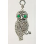A LARGE SILVER MARCASITE OWL PENDANT AND CHAIN.
