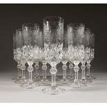 A SET OF TWELVE CHAMPAGNE FLUTES, engraved with fruiting vines.