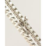 AN 18CT WHITE GOLD DIAMOND TENNIS BRACELET of 4.6cts.