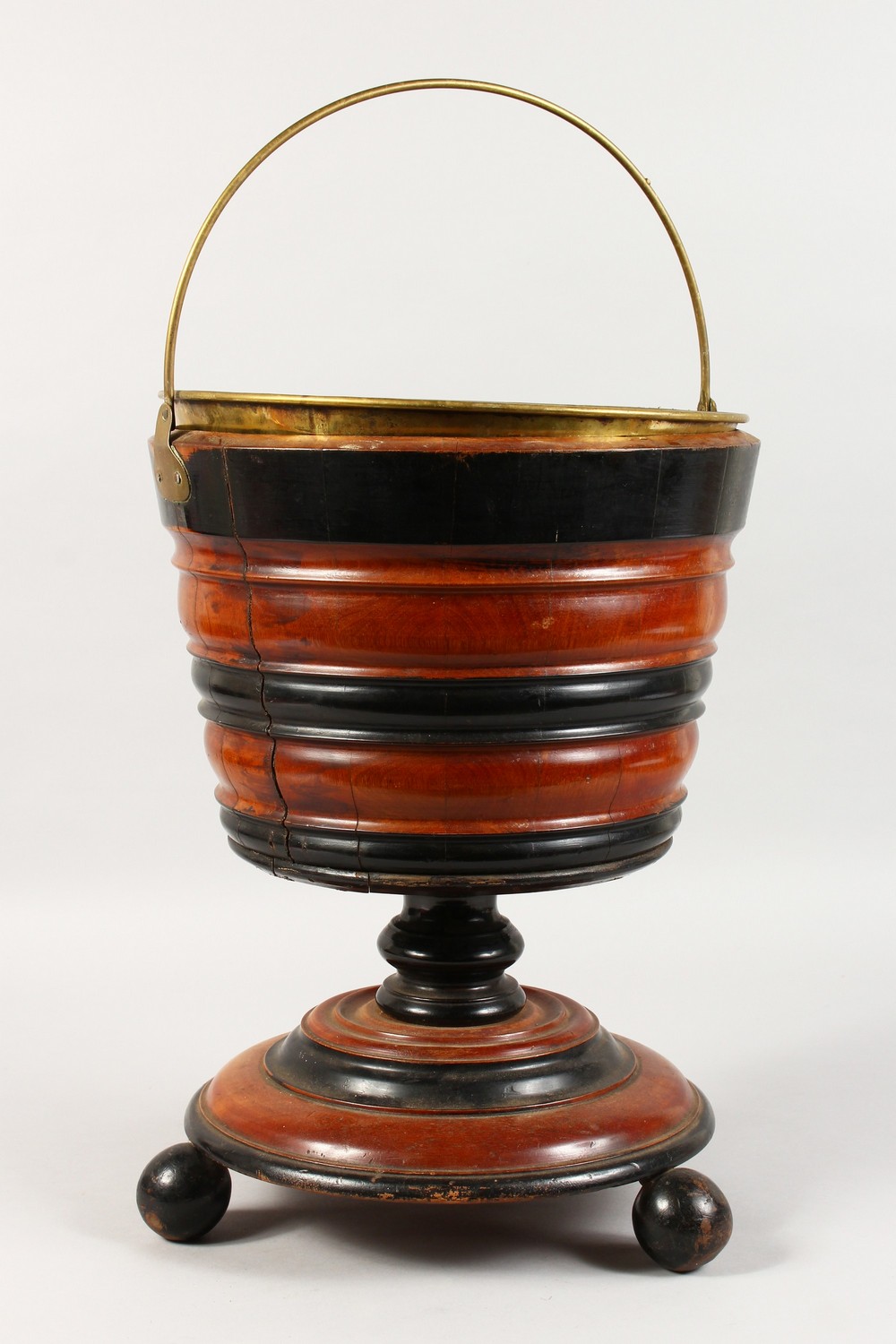 A GOOD DUTCH TWO-COLOUR WOODEN CIRCULAR BUCKET, with brass liner and handle.