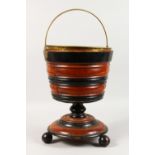 A GOOD DUTCH TWO-COLOUR WOODEN CIRCULAR BUCKET, with brass liner and handle.