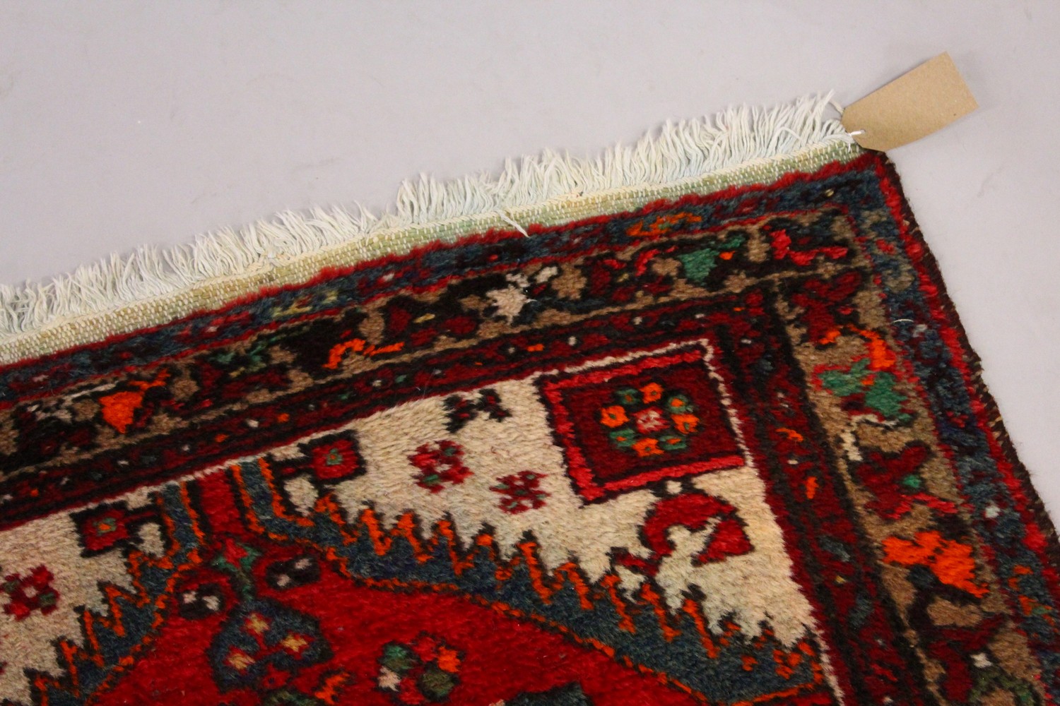 A PERSIAN RUG, with central motif and red ground. 7ft 2ins x 3ft 4ins. - Image 3 of 7