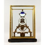 A MOON PHASE SKELETON CLOCK in a glass case. 17.5ins high including case.