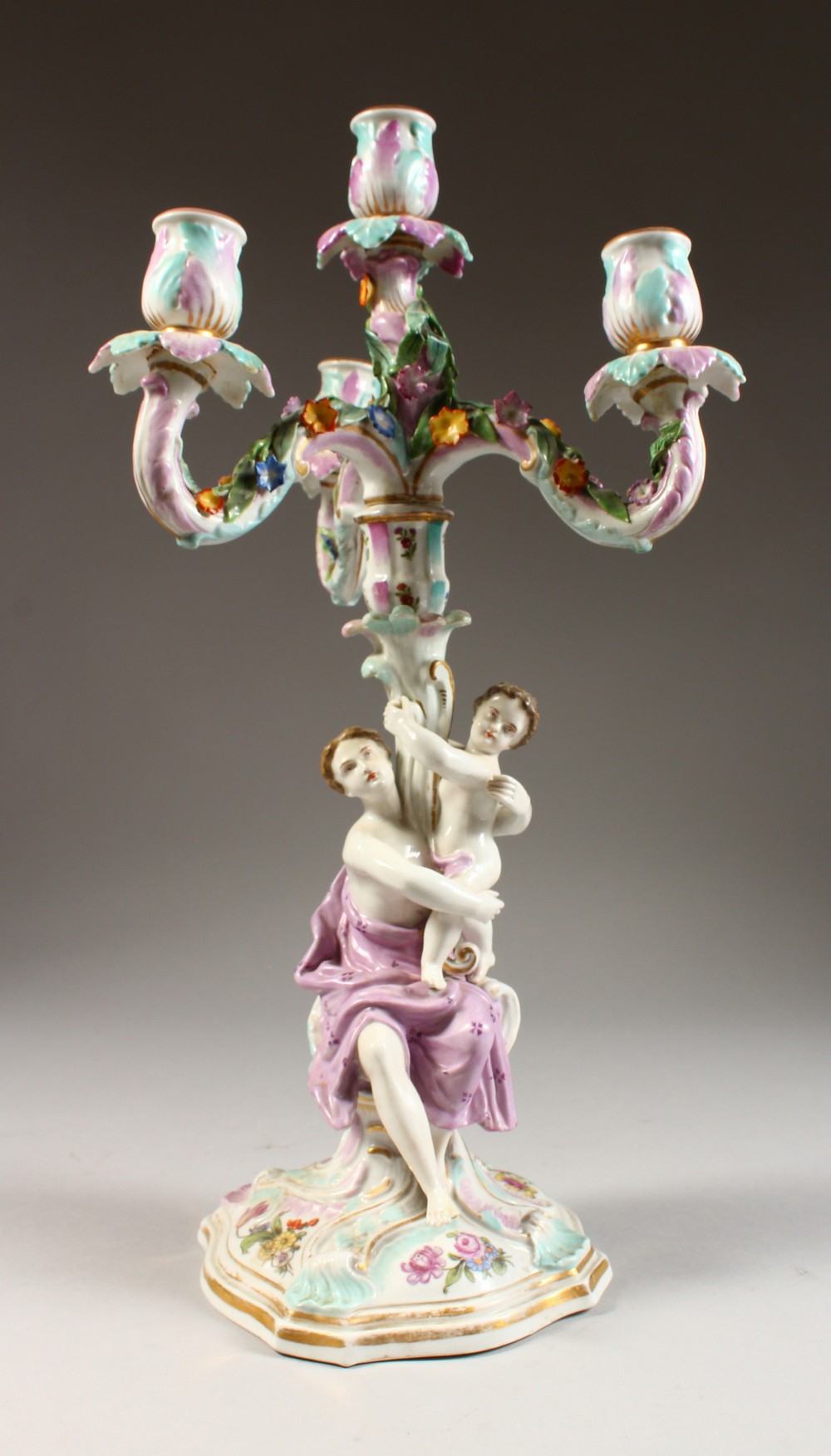 A MEISSEN DESIGN FOUR LIGHT CANDELABRA, with scrolling branches, the stem as a classical lady with