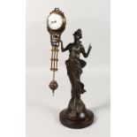 A DIANA SWING CLOCK , on a wooden base. 12.5ins high.