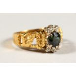 AN 18CT GOLD, EMERALD AND DIAMOND RING.