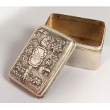 A SMALL CHINESE SILVER BOX, the lid with figures, trees and houses. 3.25ins.