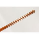 A TAPERING YEW WOOD CANE, with pique work decoration. 36ins long.