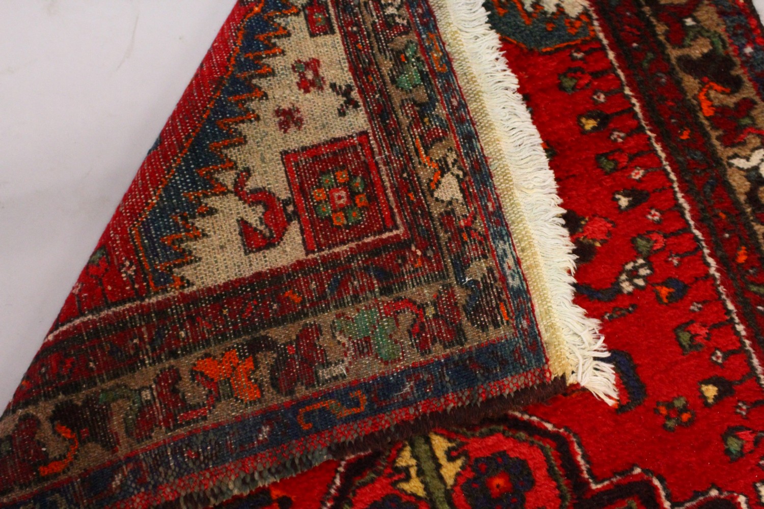 A PERSIAN RUG, with central motif and red ground. 7ft 2ins x 3ft 4ins. - Image 5 of 7