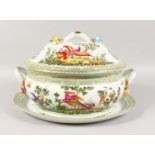 A LARGE CONTINENTAL PORCELAIN OVAL TWO-HANDLED TUREEN, COVER AND STAND, painted with birds. 18ins