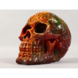 A CARVED AMBER SKULL. 5ins high.