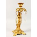 A 19TH CENTURY FRENCH SINGLE LIGHT CANDLESTICK, formed as a classical lady holding a light with