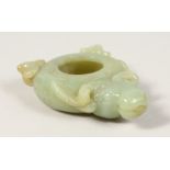A SMALL CHINESE CARVED JADE BRUSH WASHER, with rams head. 1.5ins.