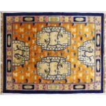 A CHINESE CARPET, rich orange ground, dragon motifs and blue border. 8ft 6ins x 5ft 8ins.