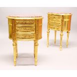 A PAIR OF GILTWOOD OVAL MARBLE TOP BEDSIDE TABLES, with three drawers on fluted legs. 2ft 2ins