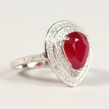 A GOOD 14K WHITE GOLD PEAR SHAPED RUBY AND DIAMOND RING, Ruby 3.23CTS.