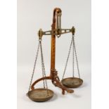 A LARGE SET OF BRASS BALANCE SCALES by DEGRAVE & CO., London. 22ins high.