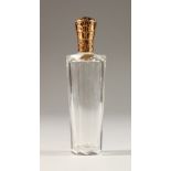 A GOLD TOP GLASS SCENT BOTTLE. 3.5ins long.