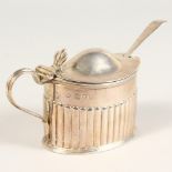 A VICTORIAN OVAL SEMI FLUTED MUSTARD POT, with glass liner. London 1893.