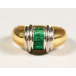 AN 18CT GOLD EMERALD SET RING.