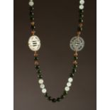 A CHINESE JADE NECKLACE, with two Chinese emblems. 16ins long.
