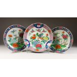 A PAIR OF ORIENTAL PLATES, flowers and birds, 10.5ins diameter, and a large plate, 12ins diameter (
