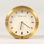 A TIFFANY & CO CIRCULAR DESK CLOCK. 3ins diameter.