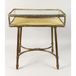 AN ORMOLU AND GLASS TWO TIER OCCASIONAL TABLE. 1ft 9ins wide x 1ft 10ins high x 1ft 2ins deep.