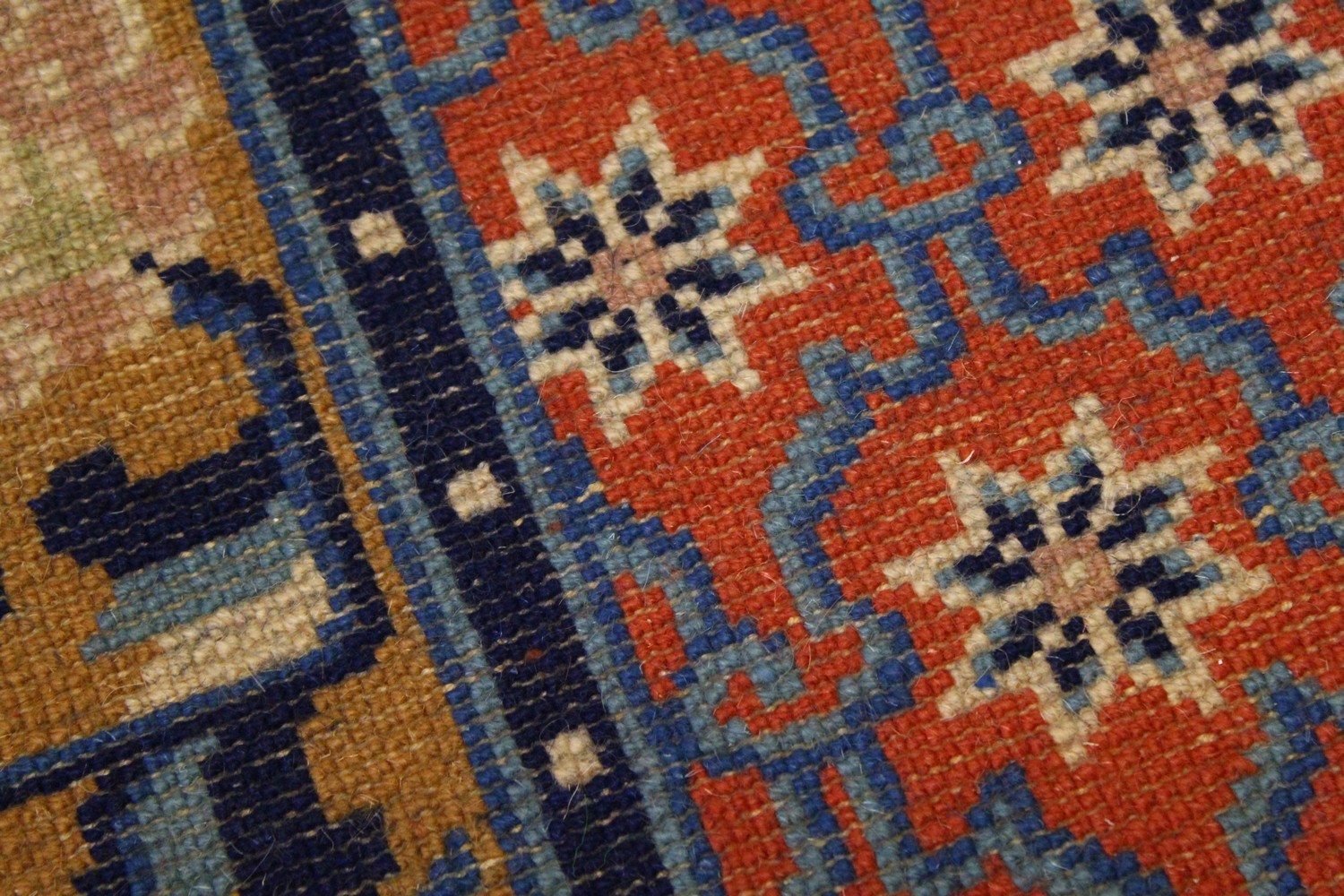 A CHINESE RUG, with red ground, motifs and blue border. 4ft 9ins x 2ft 4ins. - Image 3 of 5