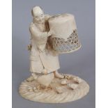 A GOOD QUALITY SIGNED JAPANESE MEIJI PERIOD IVORY OKIMONO OF A POULTRY FARMER, weighing approx.