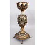 A Brass Lamp, probably Moradabad, Northern India, circa 1920-30, the bulbous body formed around a